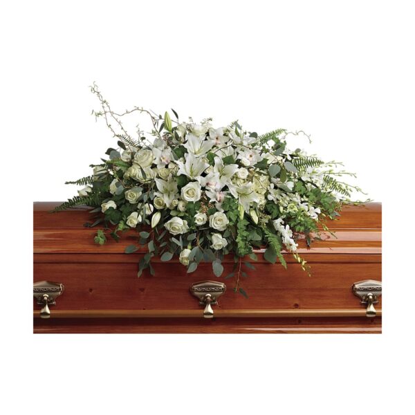Casket adorned with white flowers.