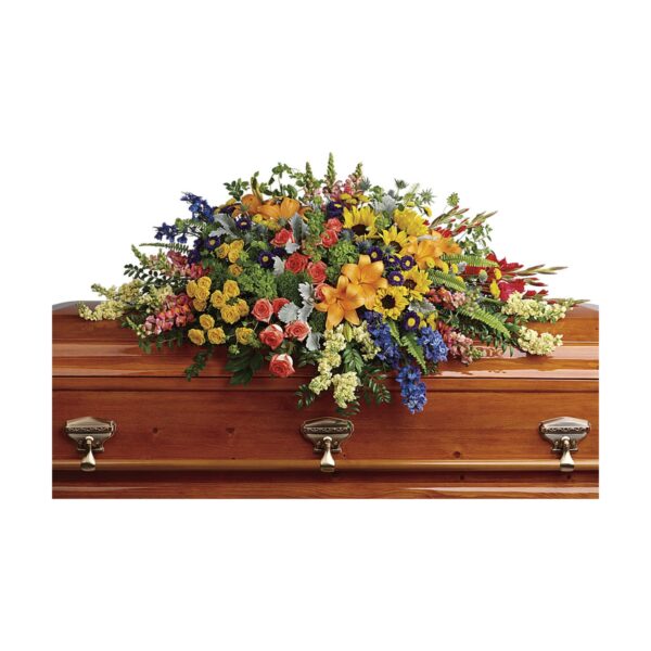 Casket adorned with colorful flowers.